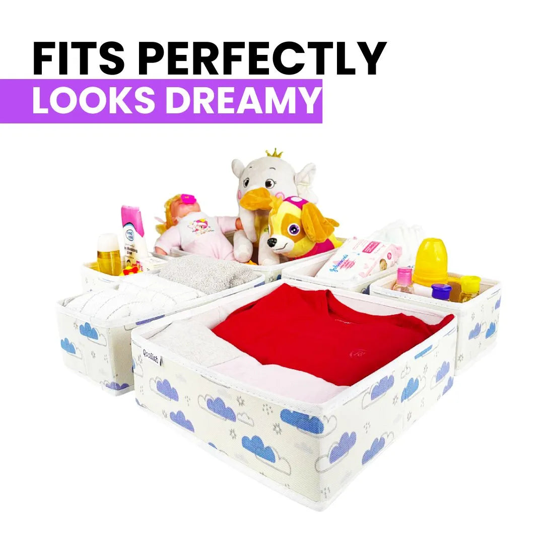 Baby nursery drawer organizers filled with clothes and baby products