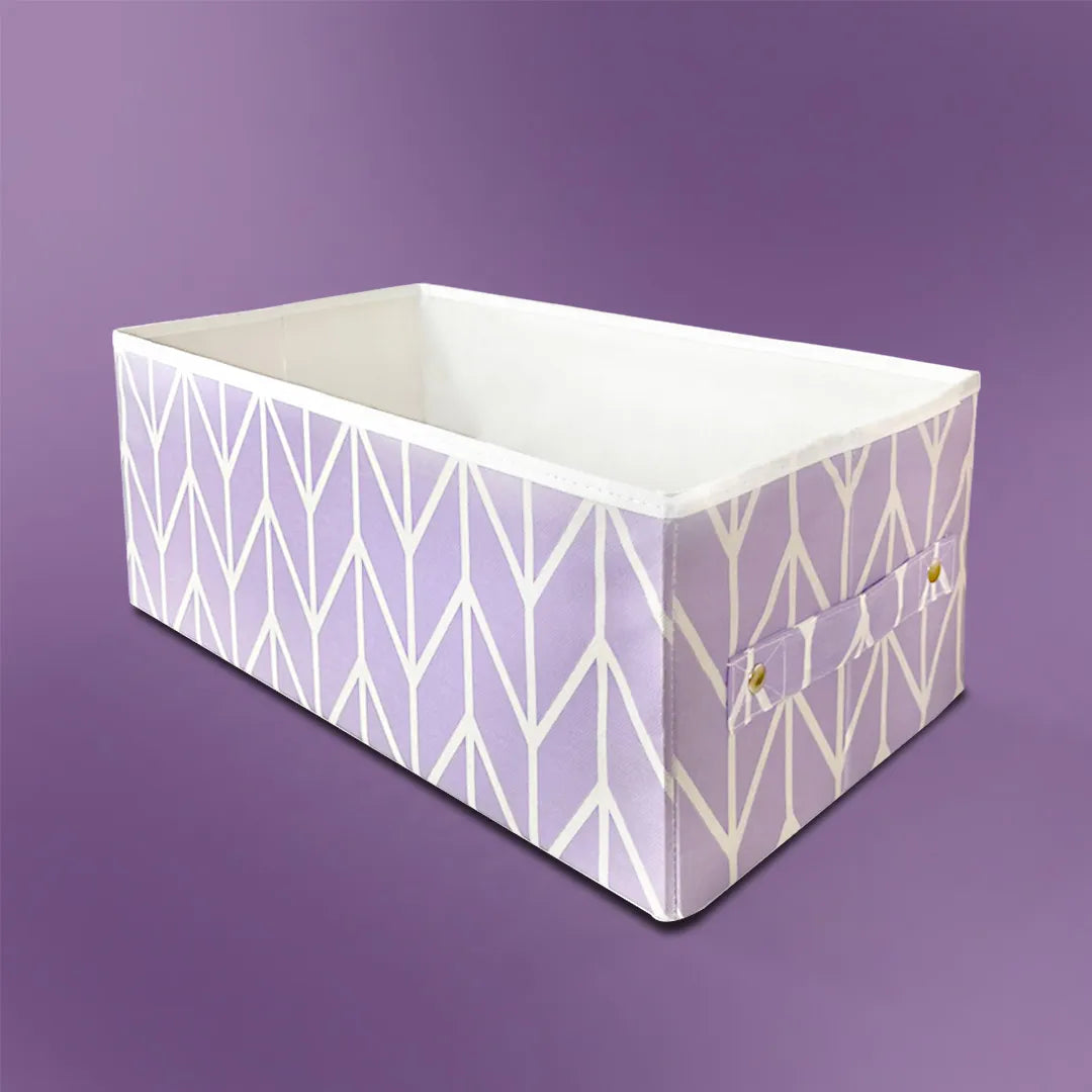 Side view of large clothes organizer box in lilac color by Qoolish with breathable design.

